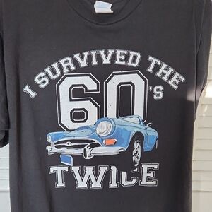 Survived The 60s . Black T-Shirt with Blue Car Graphic